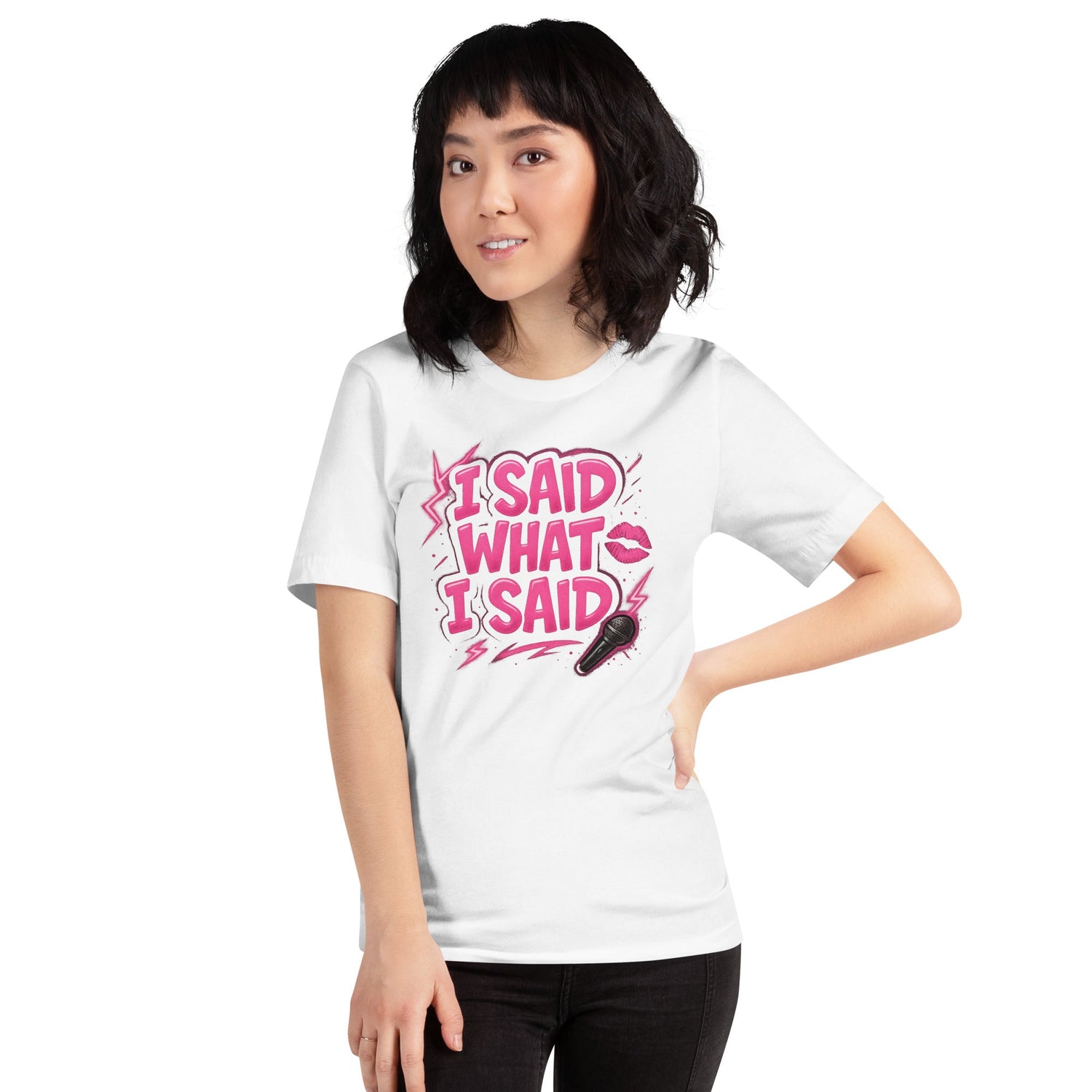 Woman wearing a white graphic t-shirt with bold pink text that says “I Said What I Said” next to a lipstick kiss and a microphone icon.